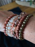 Te koop 8 oranje kleurige armbanden., Ophalen of Verzenden, Zo goed als nieuw, Oranje, Overige materialen