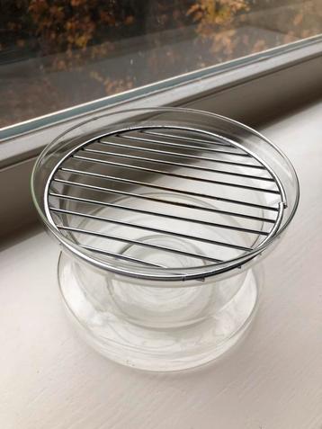 Gezellig theelichtje van hittebestendig glas beschikbaar voor biedingen