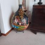 Grote beschilderde gistfles, Ophalen