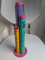 Kleurrijke gulden buizenspaarpot, Ophalen of Verzenden, Metaal of Blik, Overige thema's