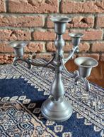 Tinnen kandelaar, Ophalen