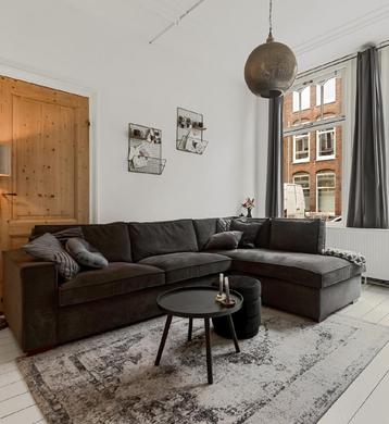 Hoekbank! Mooie en zeer comfortabele grijze Ribstof bank  beschikbaar voor biedingen
