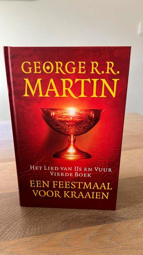 George R.R. Martin - Een feestmaal voor kraaien, Boeken, Fantasy, Zo goed als nieuw, Ophalen of Verzenden