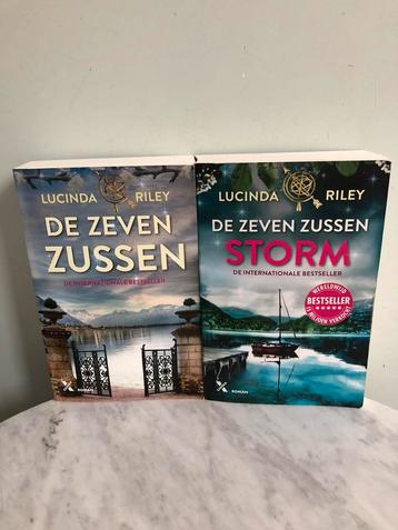 2 x Lucinda Riley, De zeven zussen en Storm, in goede staat. beschikbaar voor biedingen