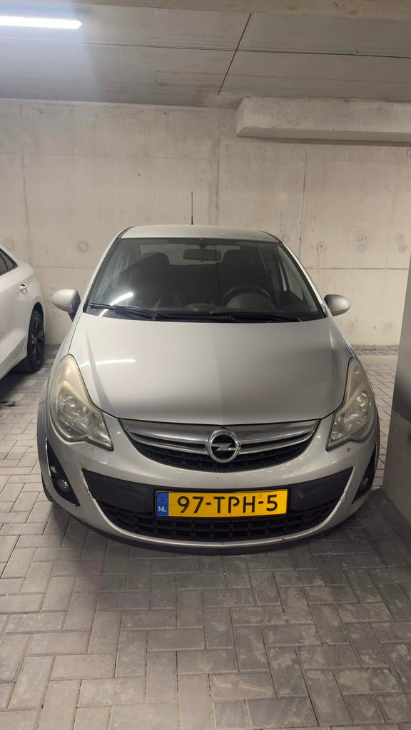 Opel Corsa 1.2 16V 5D 2012 Grijs, Voorwielaandrijving, 1063 kg, Zwart, 4 cilinders