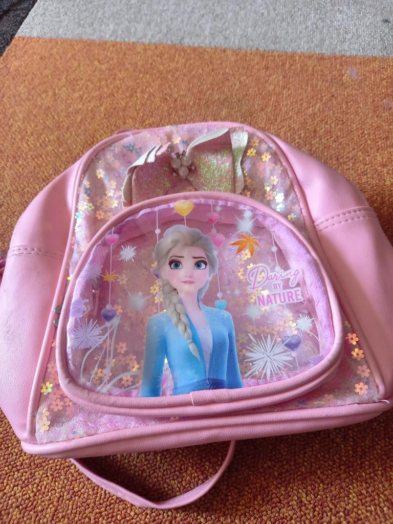 Roze Frozen rugtasje, Ophalen