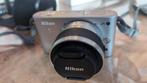 Nikon 1 J1 Camera + Nikon 10-30 mm Lens en luxe accessoires, Audio, Tv en Foto, Fotocamera's Digitaal, Compact, Ophalen of Verzenden