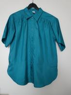 Blouse de stof is zijdeglans en de kleur is turquoise., Verzenden, Zo goed als nieuw, Maat 38/40 (M)