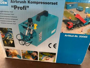 Luchtcompressor met twee verfspuiten beschikbaar voor biedingen