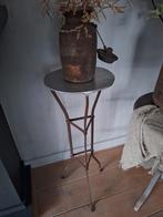 Oude ijzeren bloementafel, Ophalen