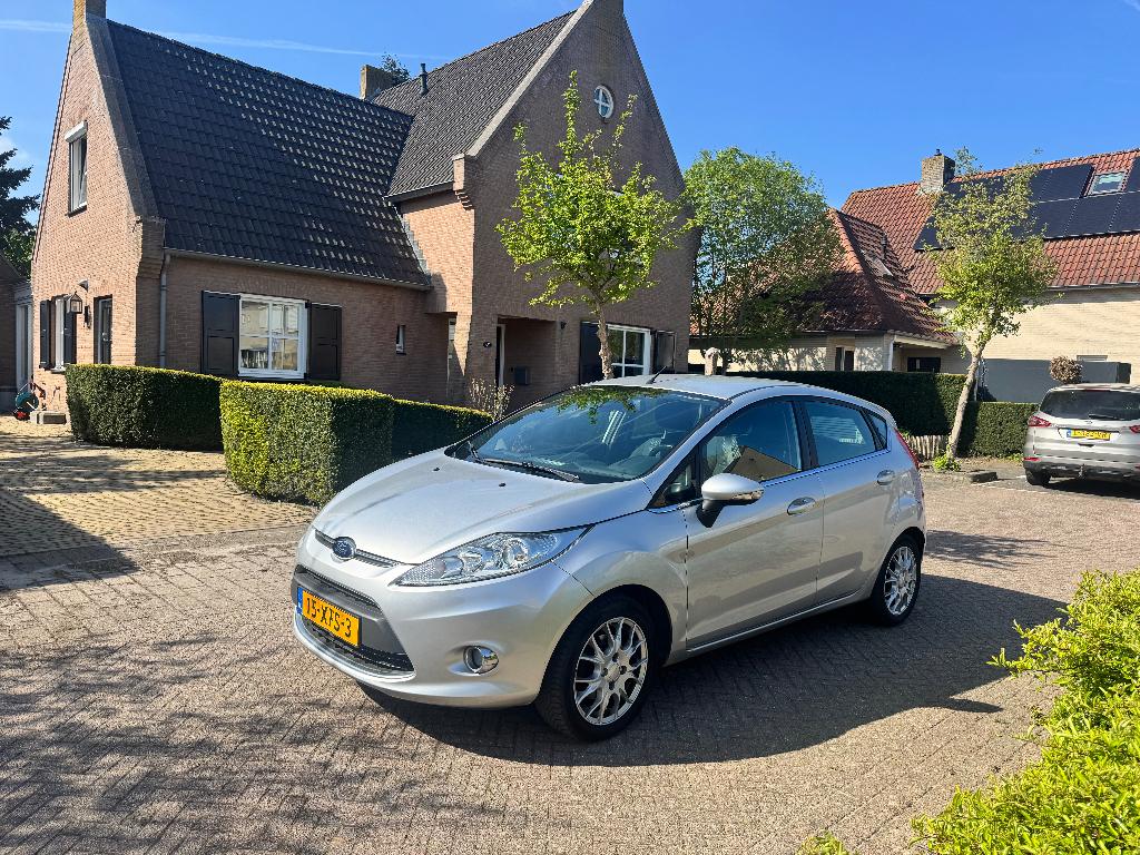 Ford Fiësta 1.25 60KW 5DR 2012 Grijs, Voorwielaandrijving, Stof, 1242 cc, Origineel Nederlands