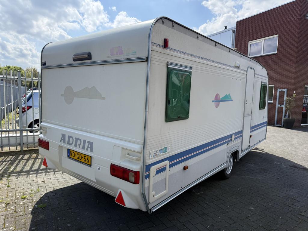 Adria 5206 Unica B 502 UP | Voortent | Rondzit | Fietsendrag, Caravans en Kamperen, Ringverwarming, Vast bed, Rondzit, Bedrijf