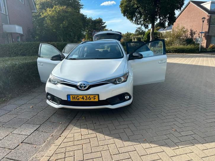 Toyota Auris 1.8 Hybrid Touring Sports CVT 2015 Wit, Auto's, Toyota, Particulier, Auris, Hybride Elektrisch/Benzine, Volledig hybride