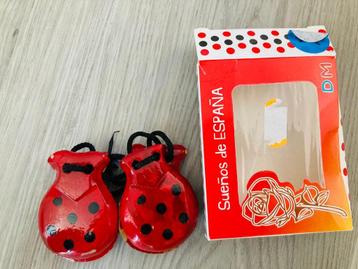 Rode Castagnetten beschikbaar voor biedingen