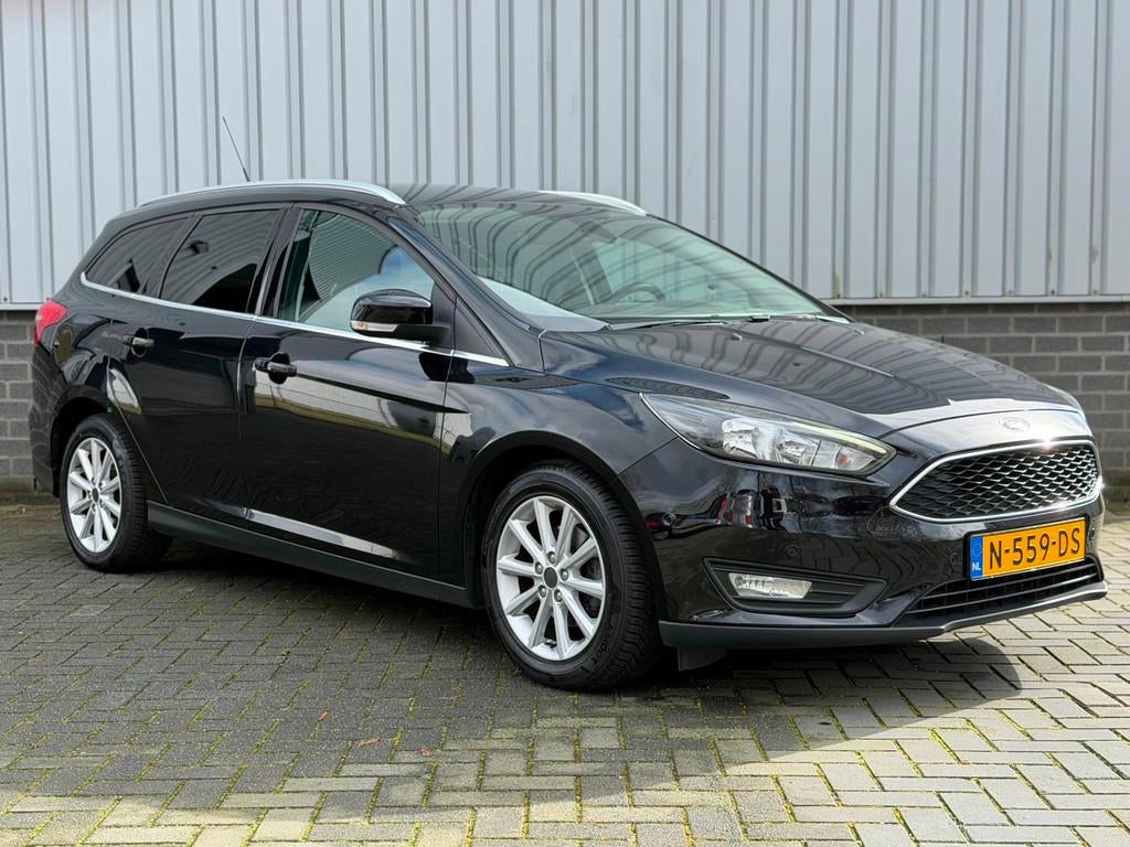 Ford Focus Wagon 1.0 Titanium |Navi|CruiseCtrl|PDC|Stuur/Sto, Gebruikt, Zwart, Handgeschakeld, 1216 kg