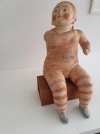 Keramiek zittende figuur., Ophalen