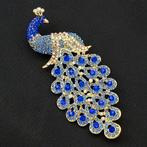 Pauw broche Blauw/wit met Swarovski elementen, Overige materialen, Verzenden, Nieuw, Goud