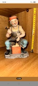 Schoenmaker beeldje, Ophalen