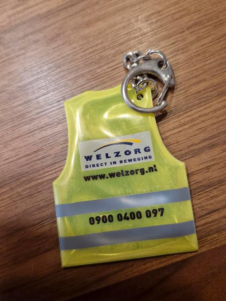 555 Veiligheidsvest Sleutelhanger Welzorg, Verzamelen, Sleutelhangers, Zo goed als nieuw, Ophalen of Verzenden