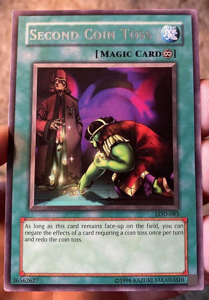 Yu-Gi-Ph! Second Coin Toss LOD Old Magic Print !, Hobby en Vrije tijd, Verzamelkaartspellen | Yu-gi-Oh!, Zo goed als nieuw, Losse kaart