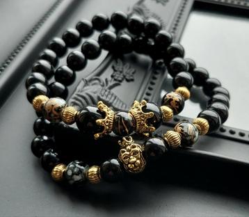 ZWARTE ONYX KRALEN ARMBAND MET GOUD KLEUR LEEUW EN KROON