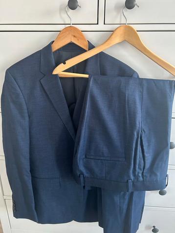 Blauw pak, skinny fit H&M, 1x gedragen beschikbaar voor biedingen