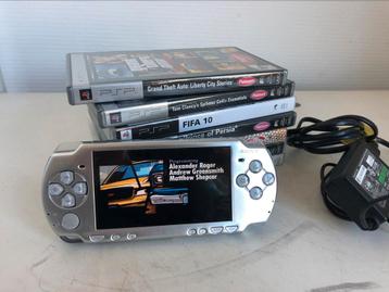 Sony psp grijs zilver compleet met lader en spellen beschikbaar voor biedingen