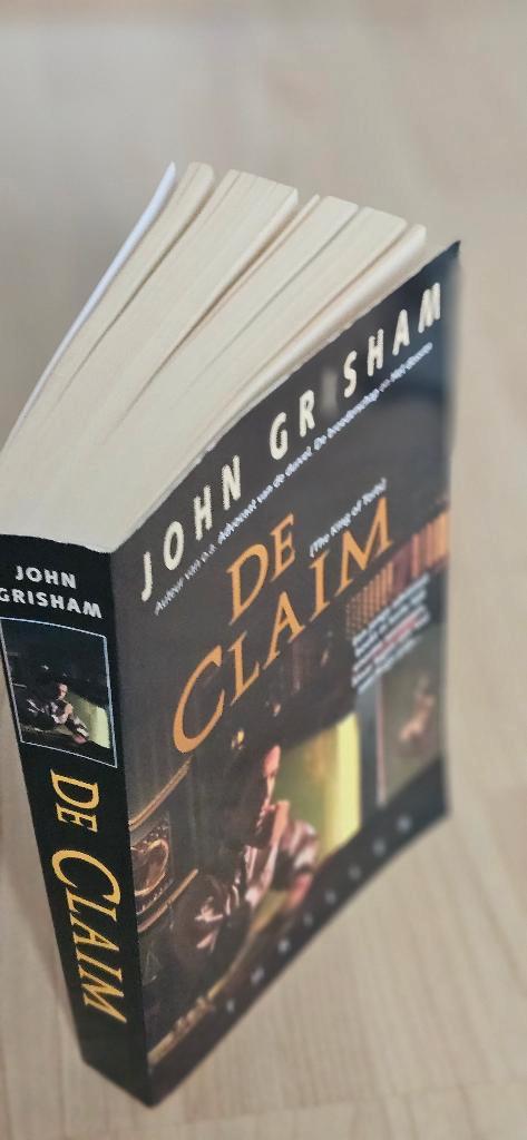 De claim, Boeken, Romans, Zo goed als nieuw, Ophalen of Verzenden