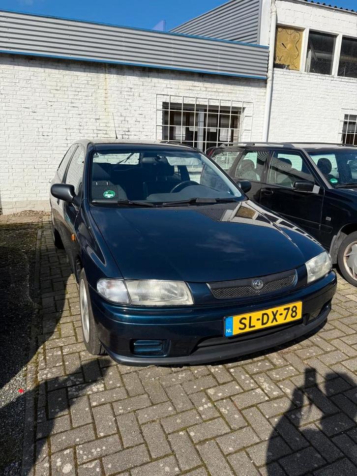 Mazda 323 1.3 P LX 54KW 1997 Blauw, Auto's, Mazda, Particulier, ABS, Airbags, Android Auto, Apple Carplay, Bluetooth, Radio, Startonderbreker