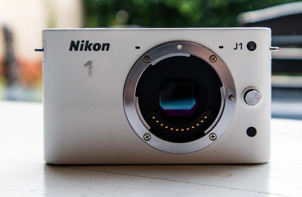 Nikon J1 body, Audio, Tv en Foto, Fotocamera's Digitaal, Compact, 10 Megapixel, Ophalen of Verzenden, Zo goed als nieuw