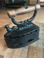 oude kolen strijkijzer, Ophalen