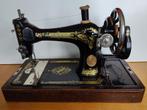 Singer naaimachine uit 1925 met kap, Ophalen