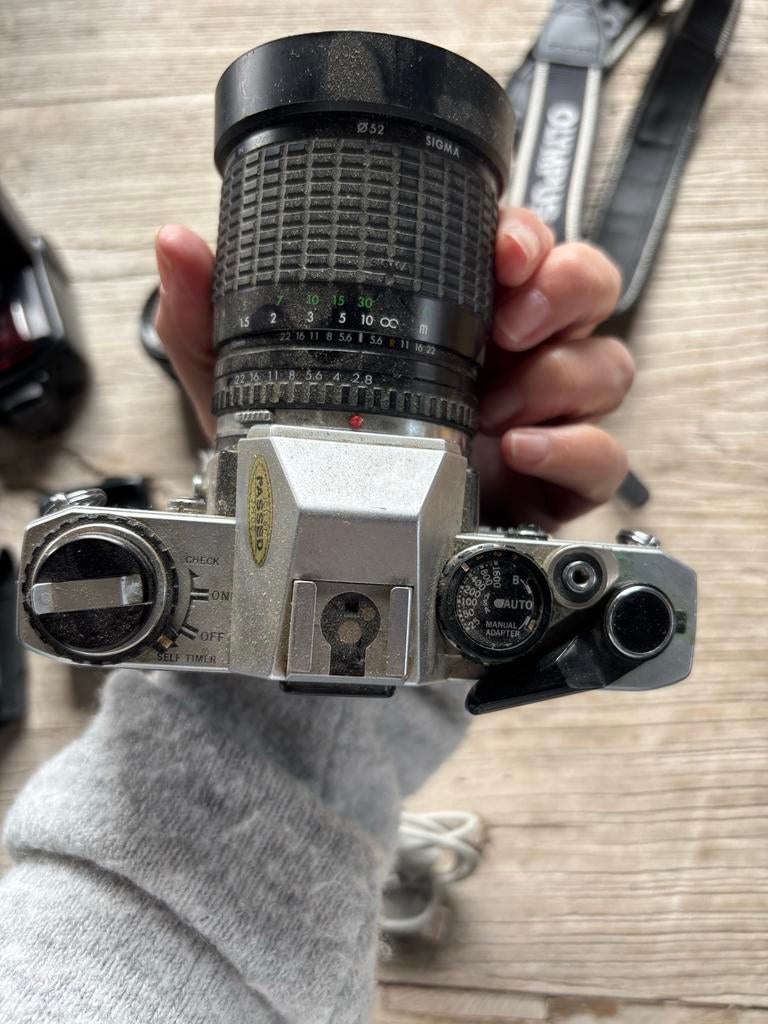 Olympus OM10 Spiegelreflexcamera met Sigma lens en accessoir, Audio, Tv en Foto, Fotocamera's Analoog, Ophalen of Verzenden, Gebruikt