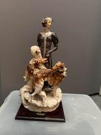 Beeld vrouw met hond, Ophalen