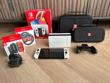 Nintendo Switch OLED Wit + Accessoires + 2 spellen beschikbaar voor biedingen