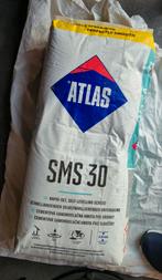 2 zakken egaline Atlas SMS 30, Ophalen, Zo goed als nieuw