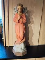 Grote engel in gips, Ophalen