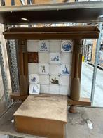 Delfsblauwe tegels op een achterwand voor een potkachel, Ophalen