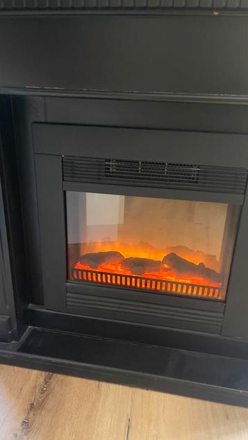 Openhaard met ingebouwde electronische verwarming beschikbaar voor biedingen