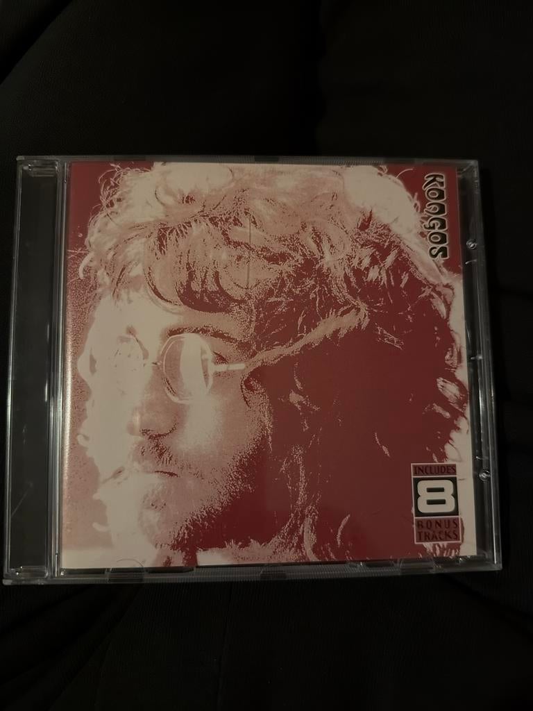 John  Koogos   Koogos, Ophalen of Verzenden, Gebruikt, Progressive