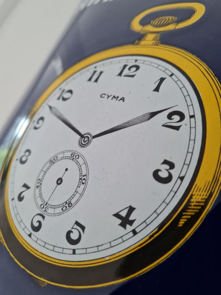 Emaille bord Cyma, Sieraden, Tassen en Uiterlijk, Horloges | Antiek, Ophalen of Verzenden, Staal, Overige merken, 1960 of later