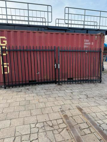 Draaipoort 5x2 meter zwart beschikbaar voor biedingen