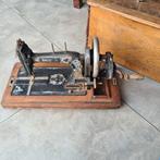 Antieke naaimachine, Ophalen