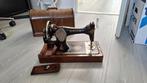 antieke handnaaimachine Singer, Ophalen