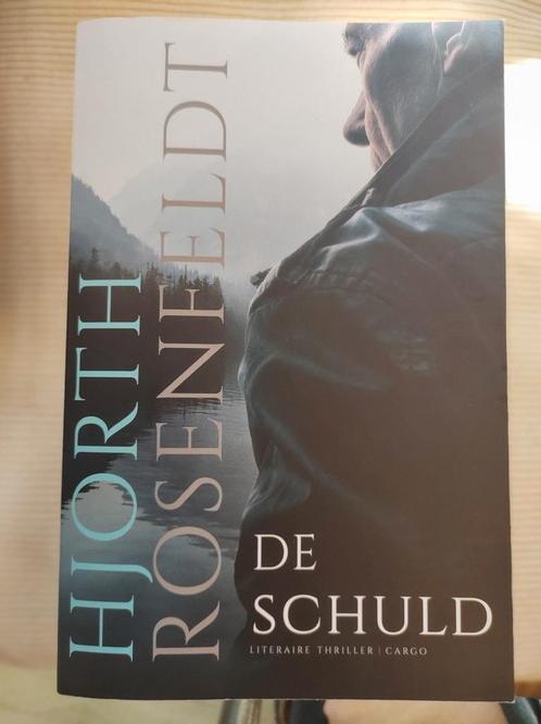 Hjorth Rosenfeldt - De schuld. Thriller, Boeken, Thrillers, Zo goed als nieuw, Ophalen of Verzenden