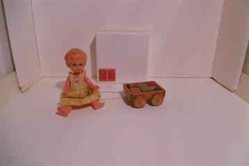 poppenhuis speelgoed blokkenkar trekkar houten blokken popje