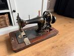 Antieke Naaimachine, Ophalen