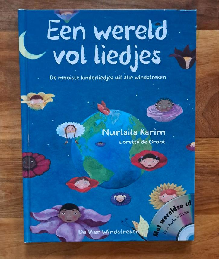 Een wereld vol liedjes - kinderliedjes uit alle windstreken, Boeken, Kinderboeken | Baby's en Peuters, Zo goed als nieuw, 3 tot 4 jaar