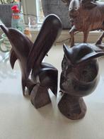 Uit hout gesneden dieren. Uil, pelikaan, dolfijn., Ophalen