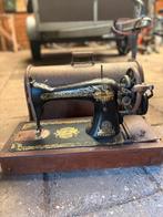 Antieke singer naaimachine, Ophalen